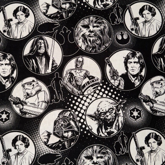 Black-and-white Star Wars character portraits on black fabric.