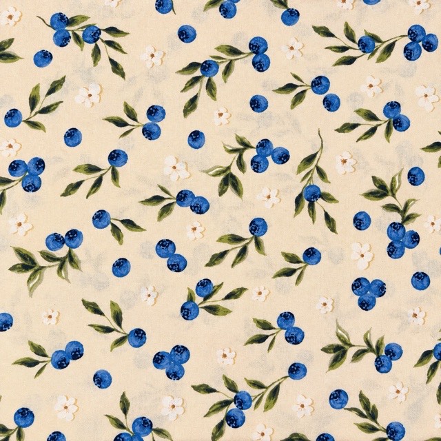 Blueberry clusters, green leaves, and white blossoms on cream.